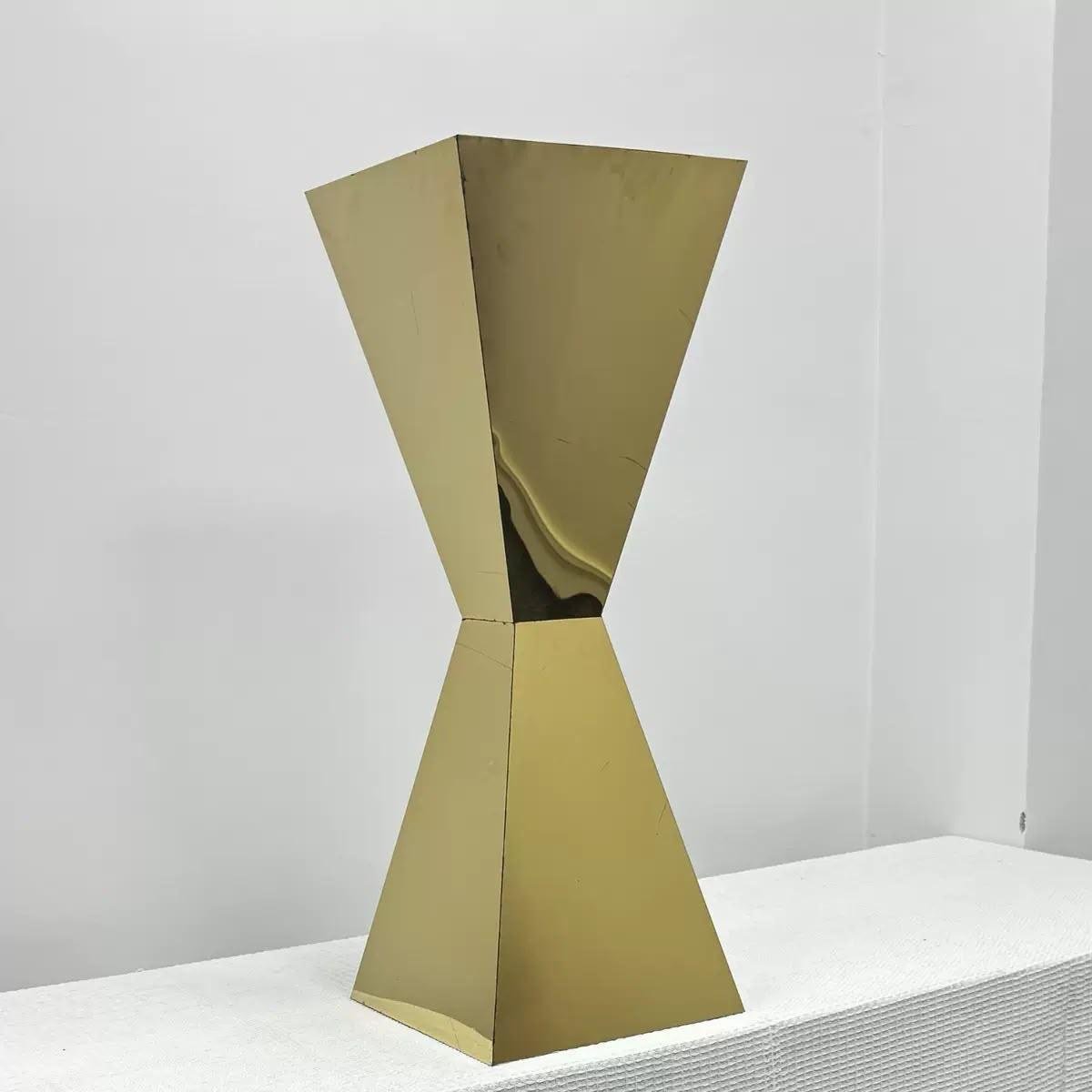 Gold hourglass plinth stand